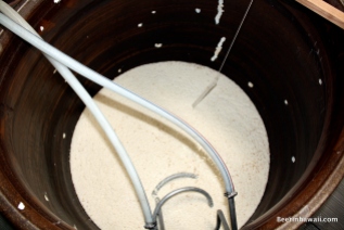 The Koji rice in a fermentation vat. At this point rice is mixed with water to create something almost like porridge.